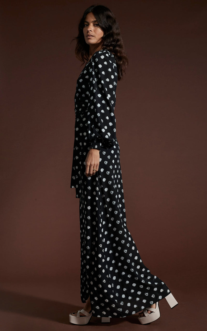 Dancing Leopard model wearing Mariela Maxi Dress In Painted Dot facing side on