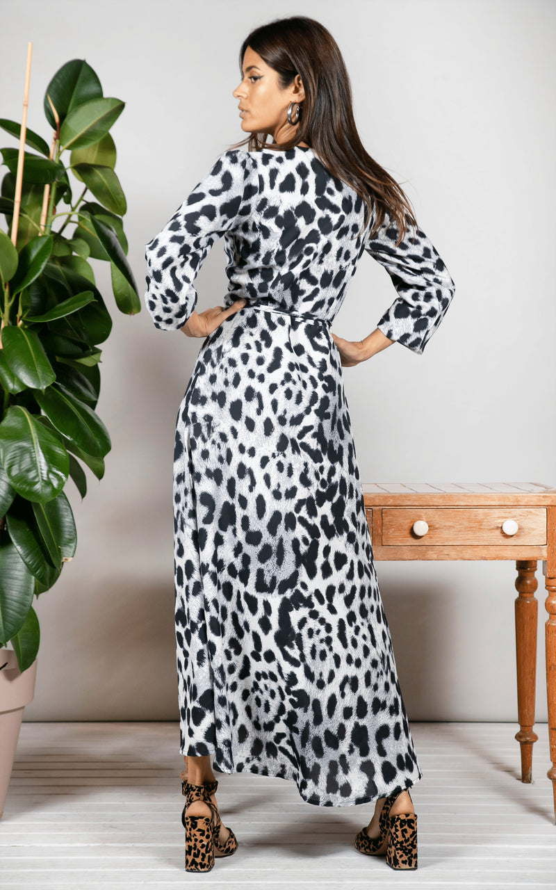 Backward-facing model looks over shoulder wearing Jagger Maxi Dress in mono leopard print